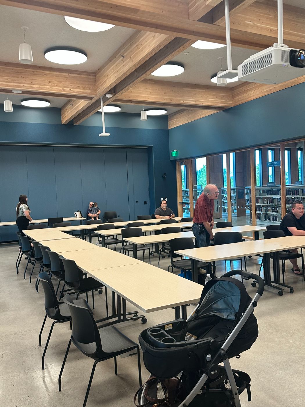 People gathered in a library meeting room for Miracle Service